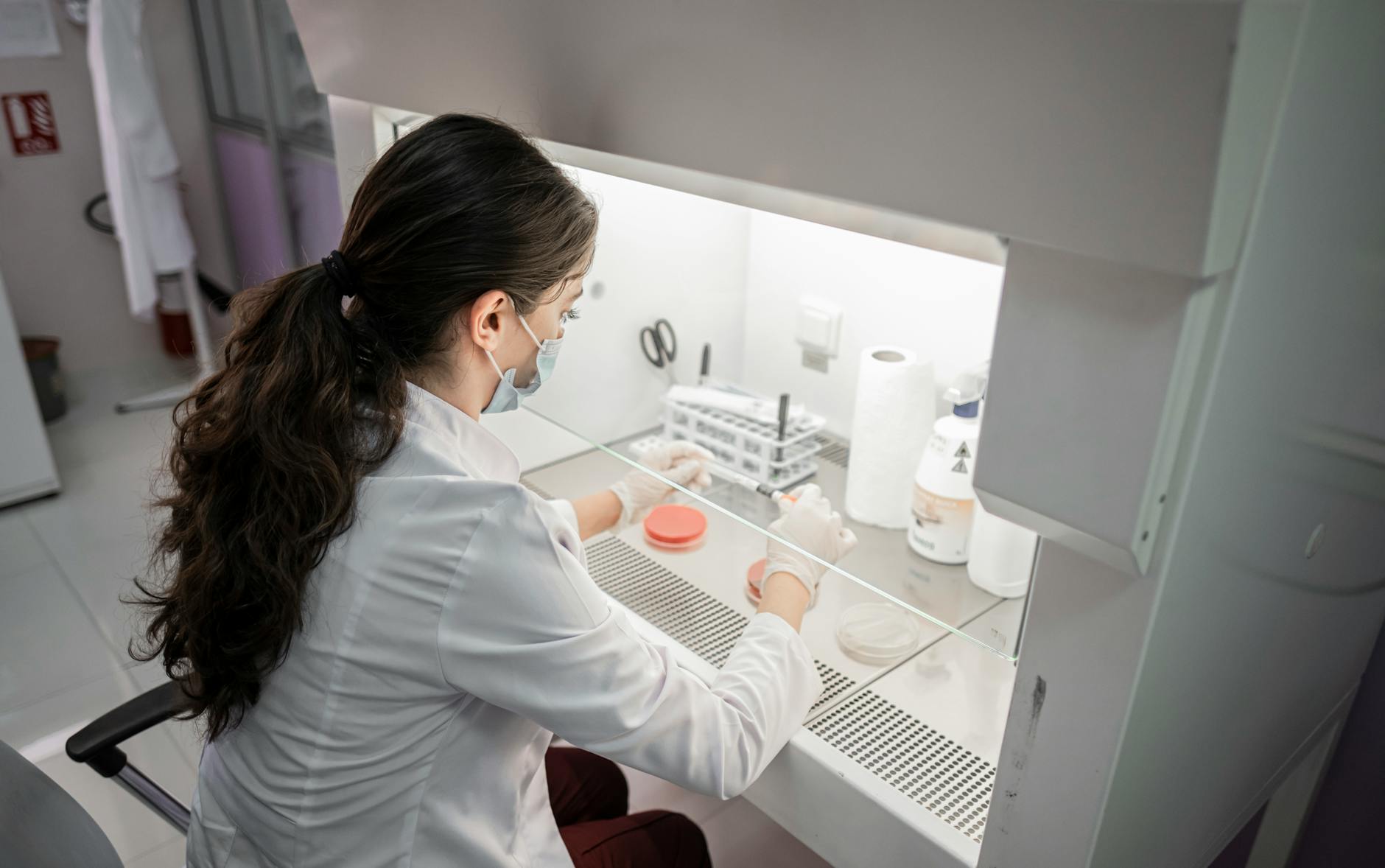 Woman in White Long Sleeve Shirt in Laboratory