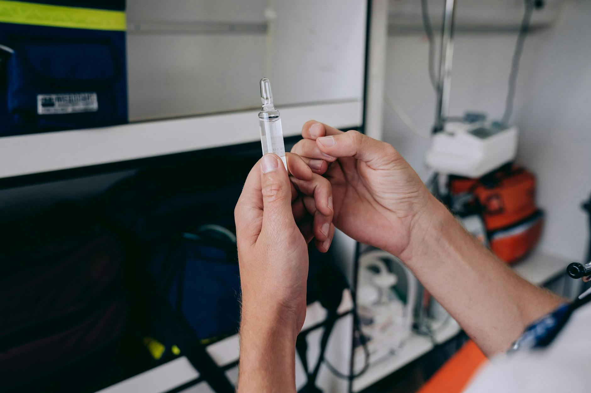 Man Hands Holding Vial of Medicine